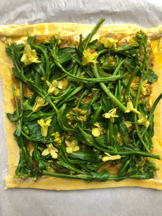Savory broccolini tart made with Bella Cucina Golden Pepper Pesto – a fresh, seasonal recipe with pantry staples.