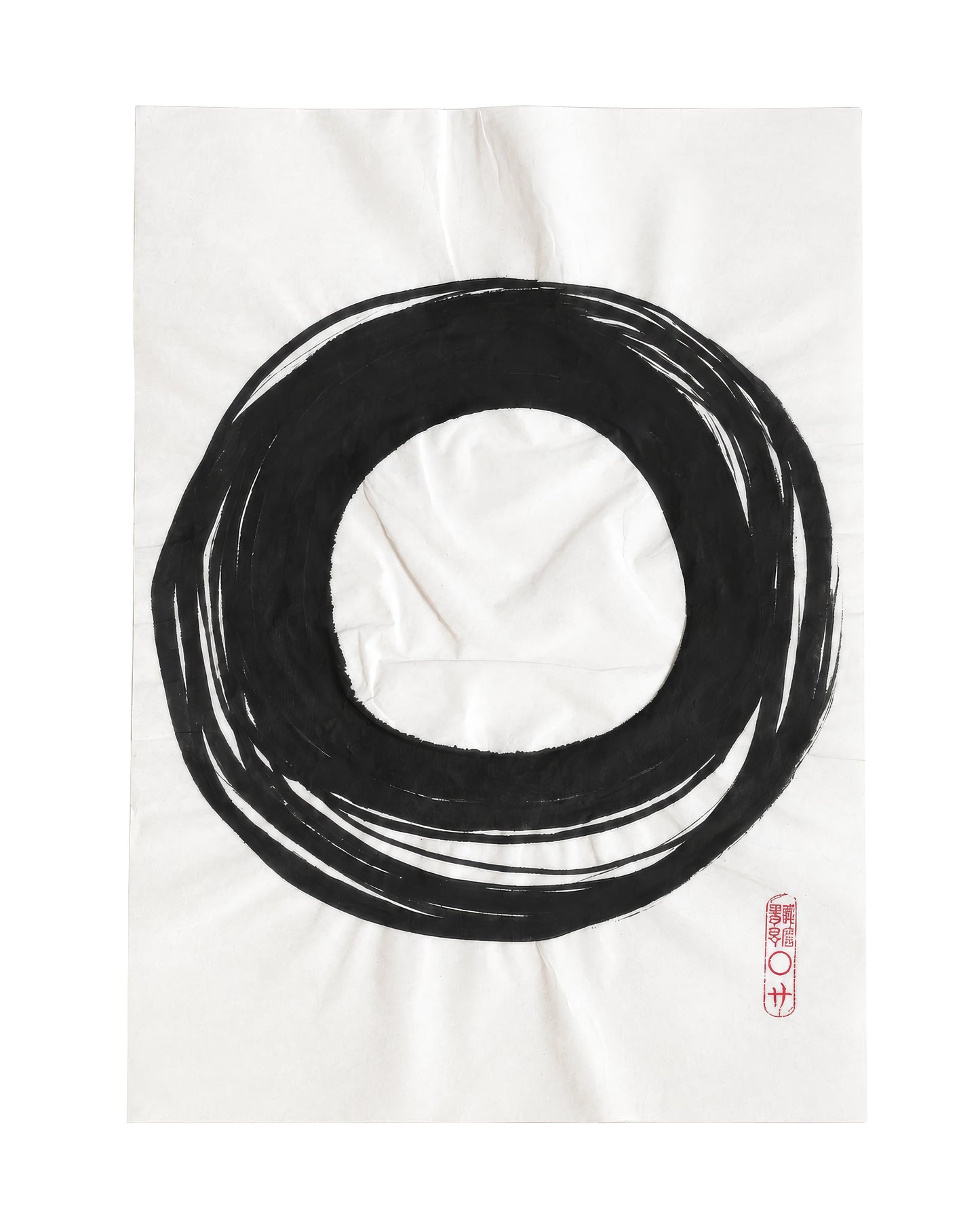 A minimalist black ink circle art print on a white fabric background, featuring a small red seal in the bottom right corner.
