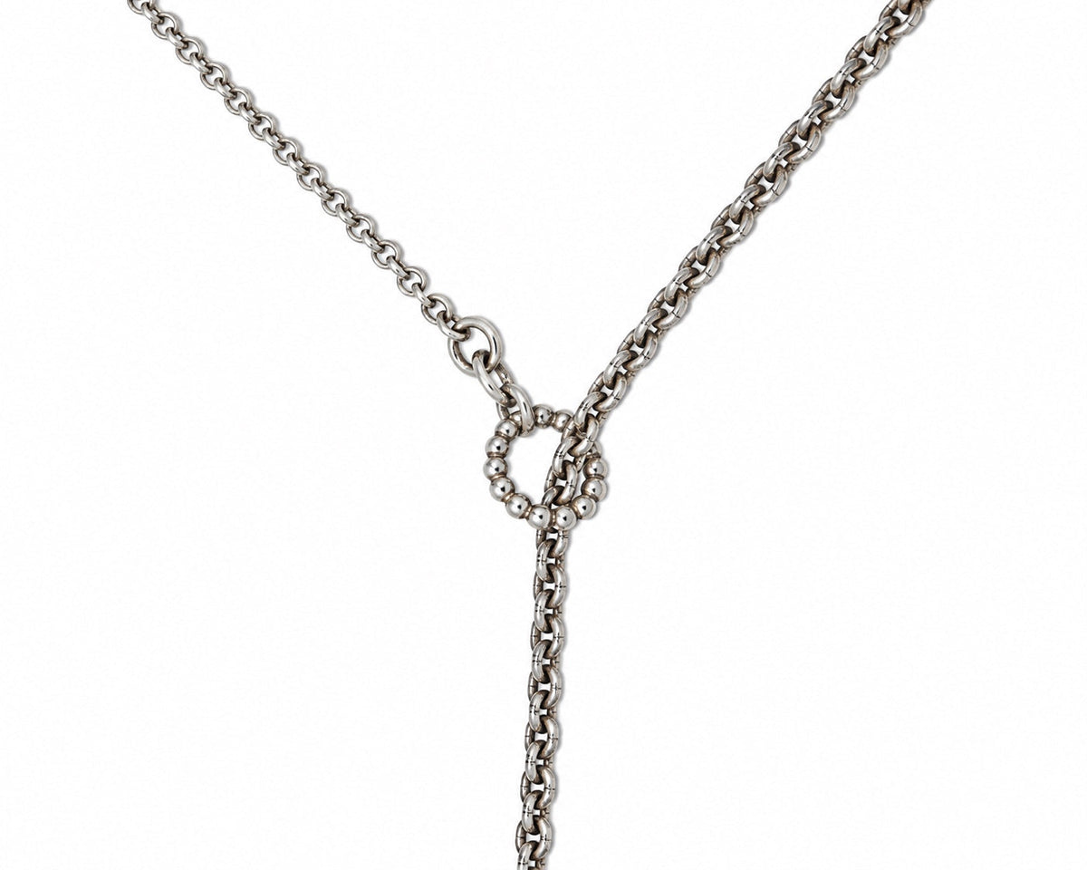 Long silver-tone chain necklace detail at Bella Cucina