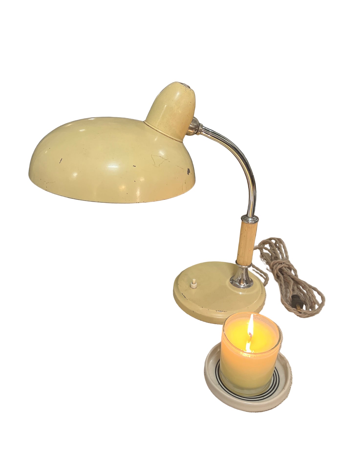 Vintage-style wall sconce with a single light bulb on a textured wall.