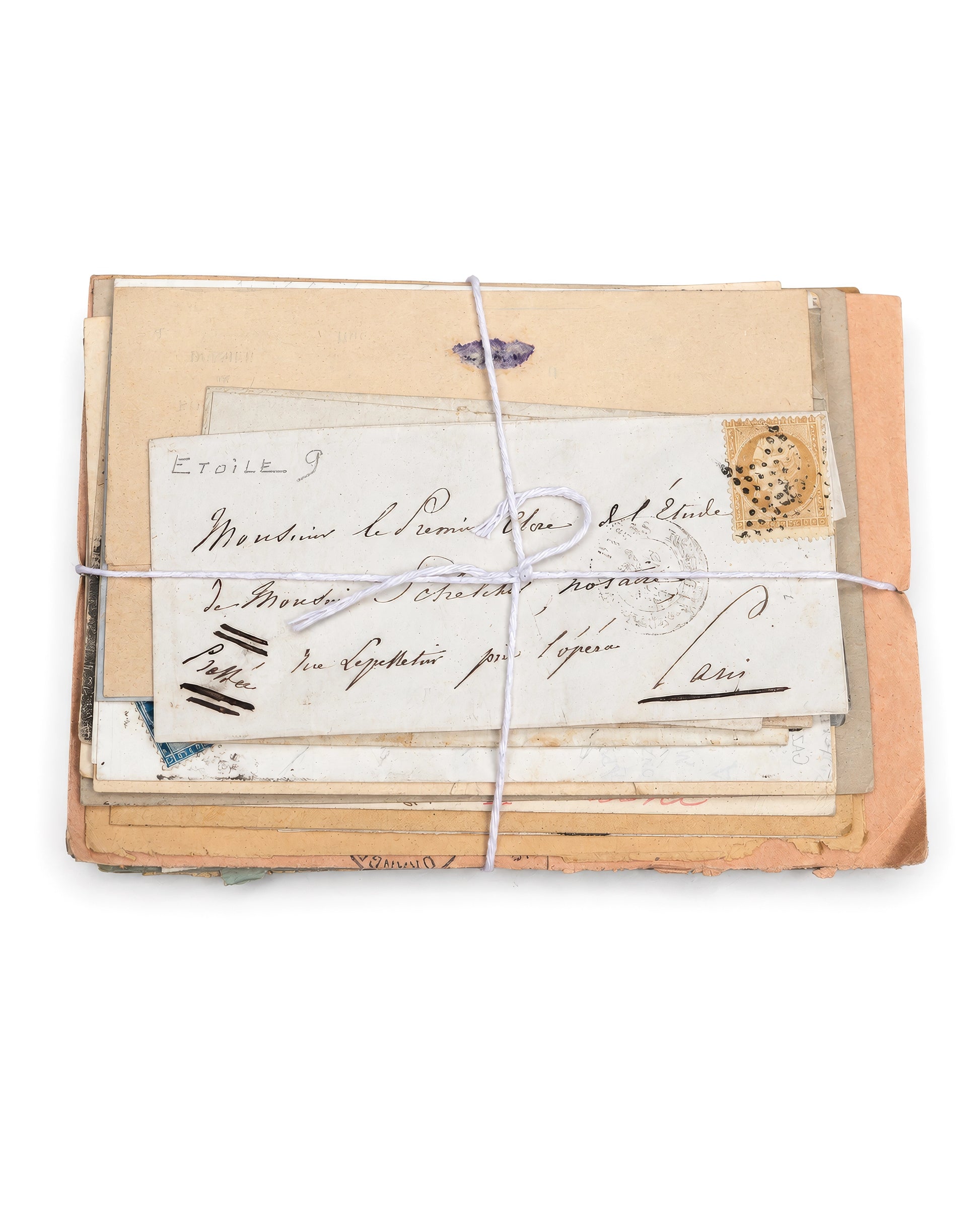 A vintage bundle of handwritten letters and envelopes tied together with white string. Bundle No. 2 of six one-of-a-kind vintage letter bundles at Bella Cucina.