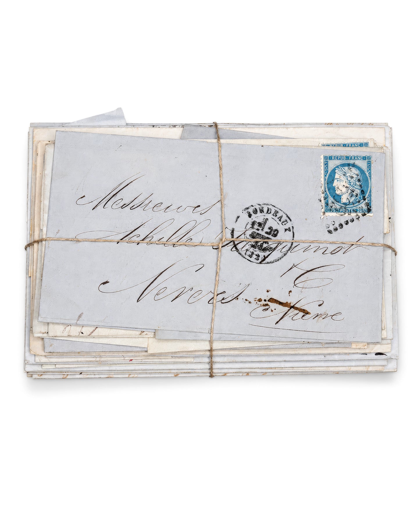 A vintage bundle of handwritten letters tied with twine, featuring an aged off-white envelope with cursive writing and a blue postage stamp. Bundle No. 3 of six one-of-a-kind vintage letter bundles at Bella Cucina.