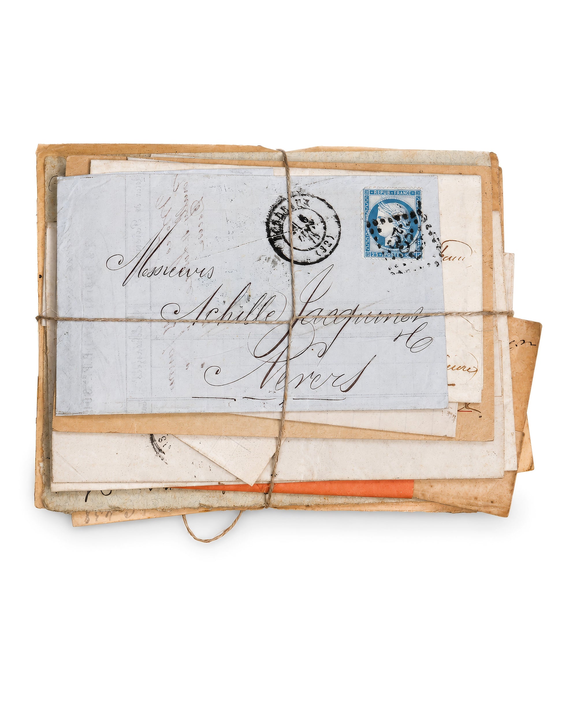 A vintage bundle of old letters and envelopes tied with twine, featuring a prominent off-white letter with elegant cursive writing and a blue postage stamp. Bundle No. 4 of six one-of-a-kind vintage letter bundles at Bella Cucina.