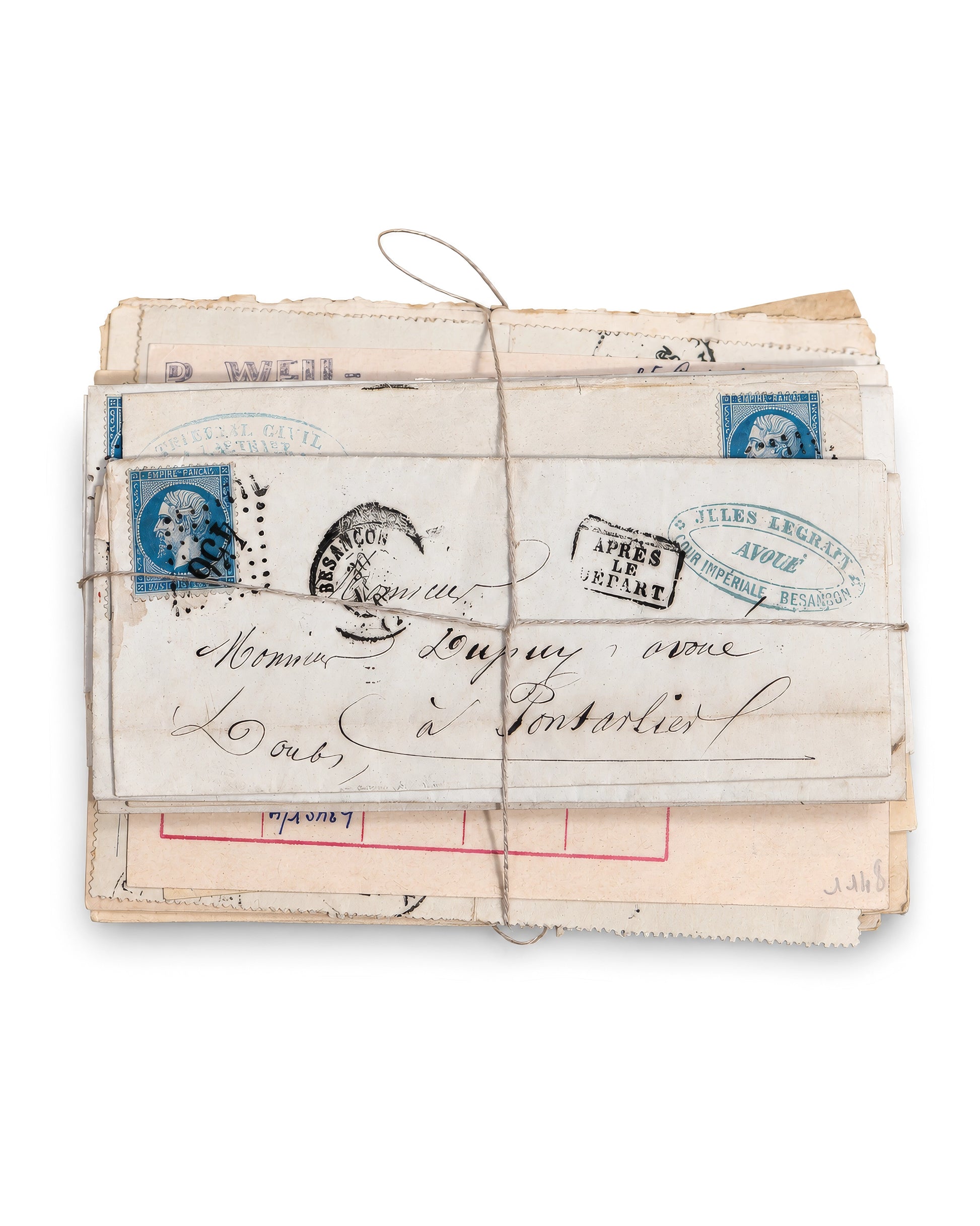 A vintage bundle of old French mail envelopes tied together with twine, featuring blue postage stamps and handwritten addresses. Bundle No. 5 of six one-of-a-kind vintage letter bundles at Bella Cucina.