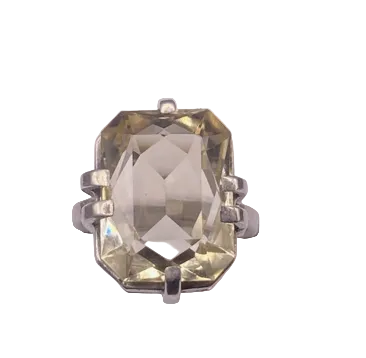 Ring with a large rectangular gemstone on a white background