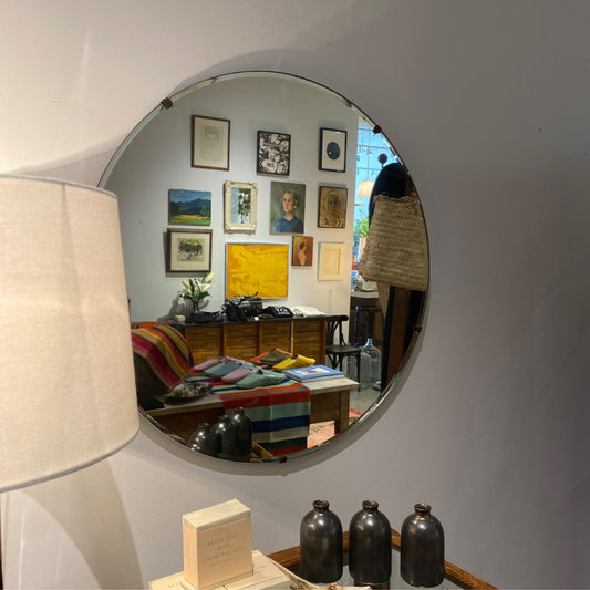 Vintage round wall mirror at Bella Cucina in Atlanta
