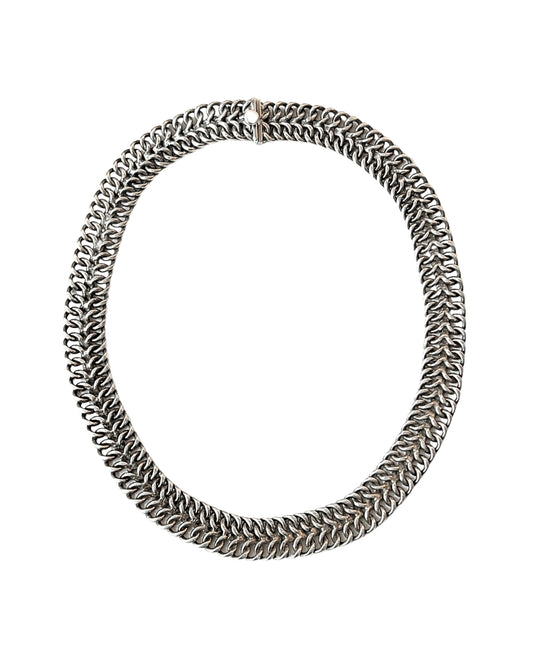 A chunky silver-toned chain-link necklace with a textured, woven appearance, shown on a plain white background.
