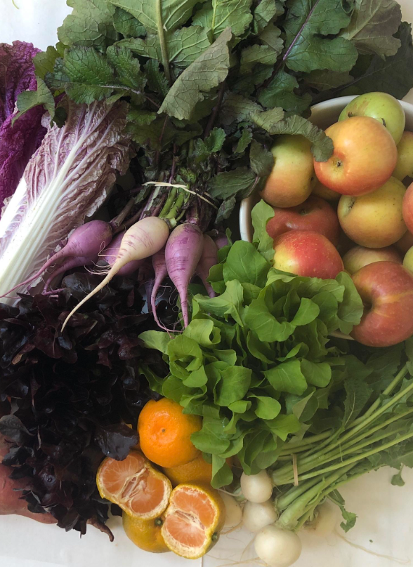 Farmer's market subscription basket with seasonal produce from Bella Cucina in Atlanta