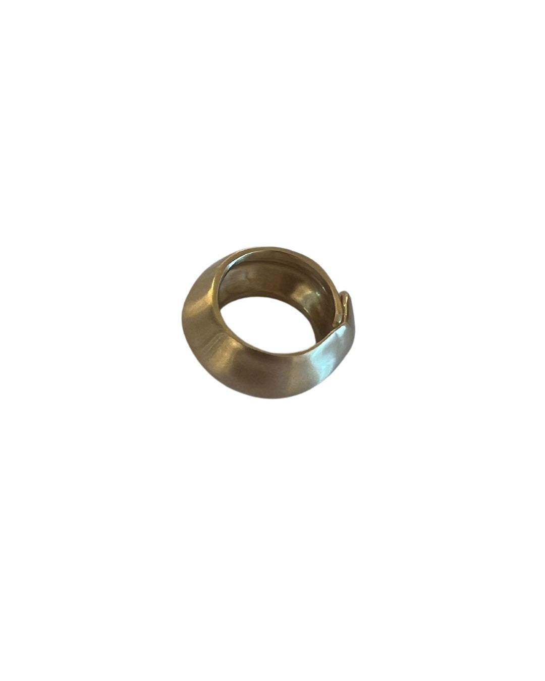 Handcrafted brass ring with a minimalist design and warm golden hue, perfect for everyday wear or stacking with other rings.