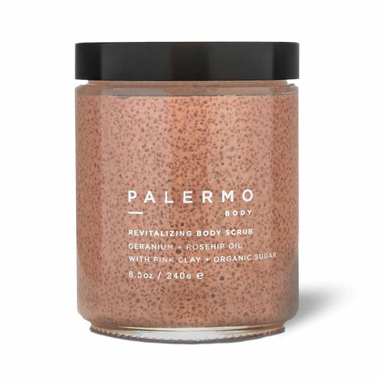 A jar of Palermo Body Revitalizing Body Scrub, featuring geranium, rosehip oil, pink clay, and organic sugar for deep hydration and exfoliation.