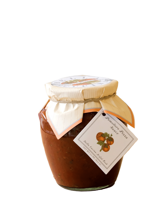 Jar of preserve with a decorative bow and label on a wooden surface