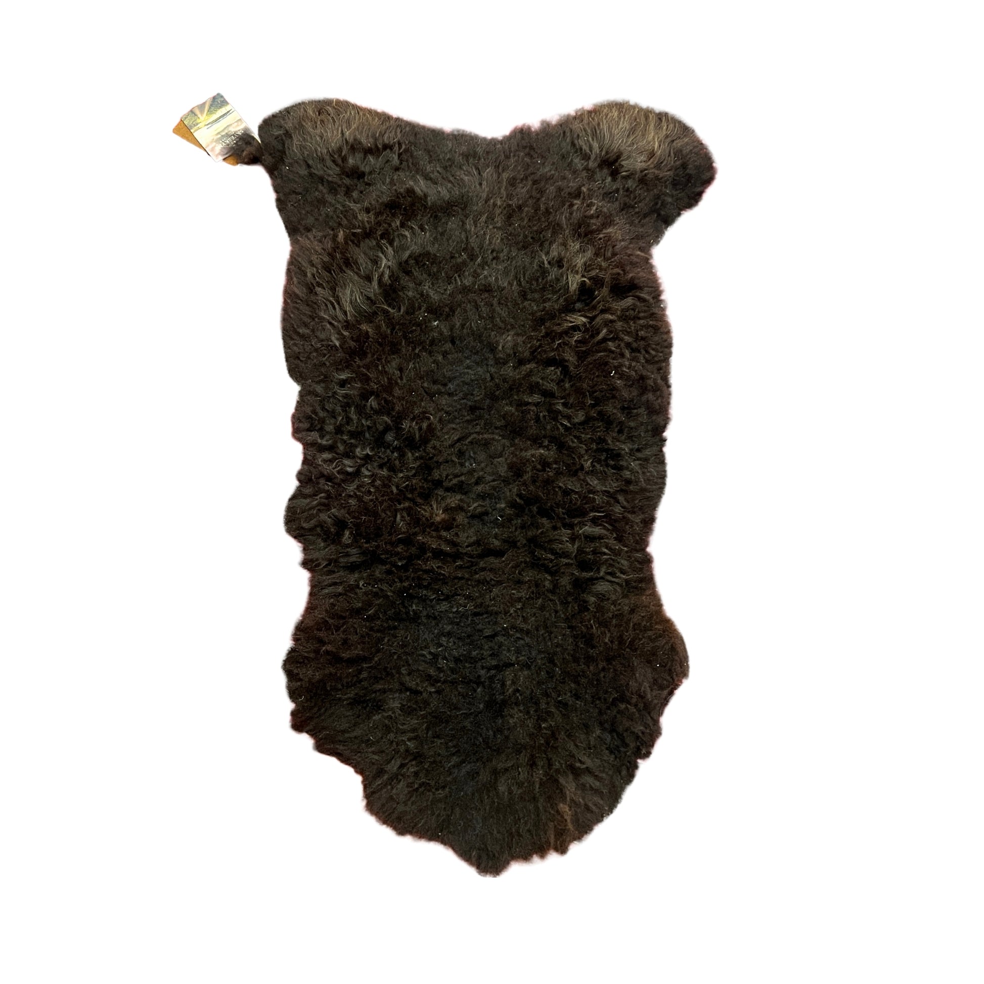 Fur rug shaped like a bear on a white background