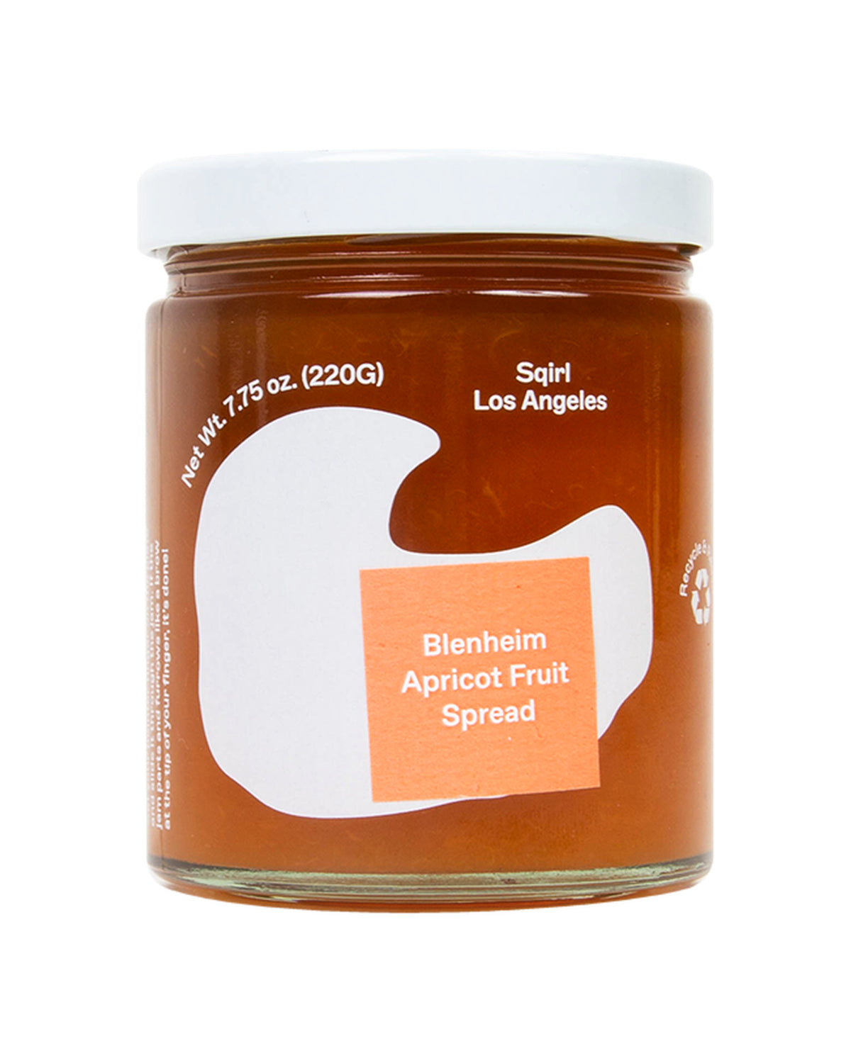 A glass jar of Bienheim Apricot Fruit Spread by Sqirl Los Angeles, featuring a white lid and a label with a white abstract shape and an orange square label.