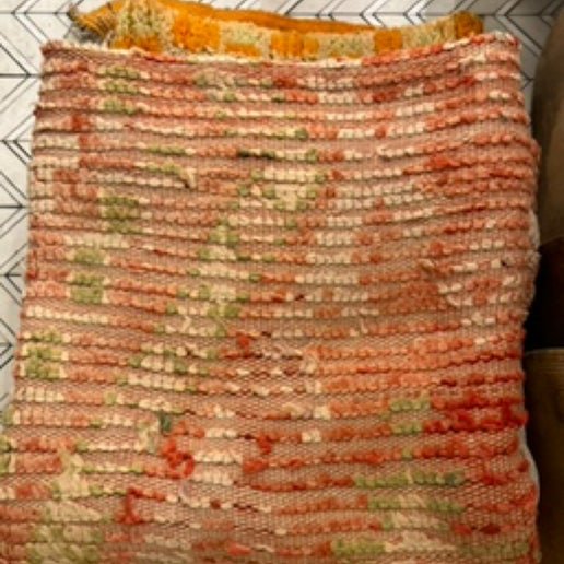 Large vintage Moroccan rug in pink and green at Bella Cucina in Atlanta