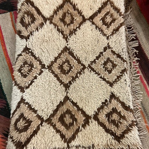 Vintage Moroccan rug in oyster and tan pattern at Bella Cucina in Atlanta