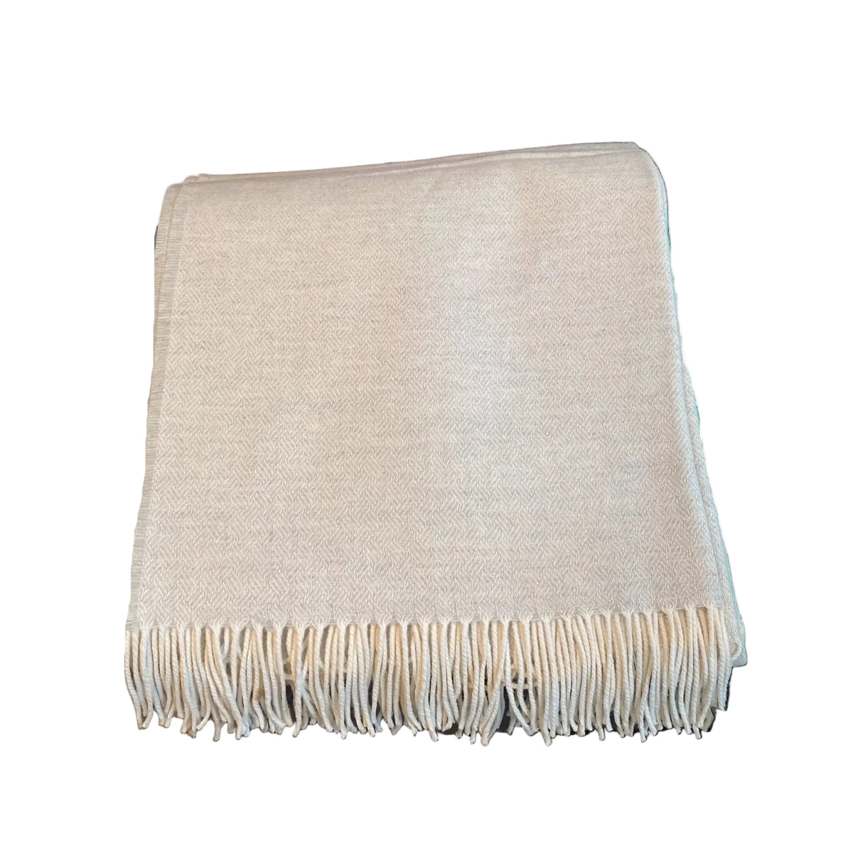 Hand-made alpaca throw blanket with hand-knotted fringe at Bella Cucina in Atlanta