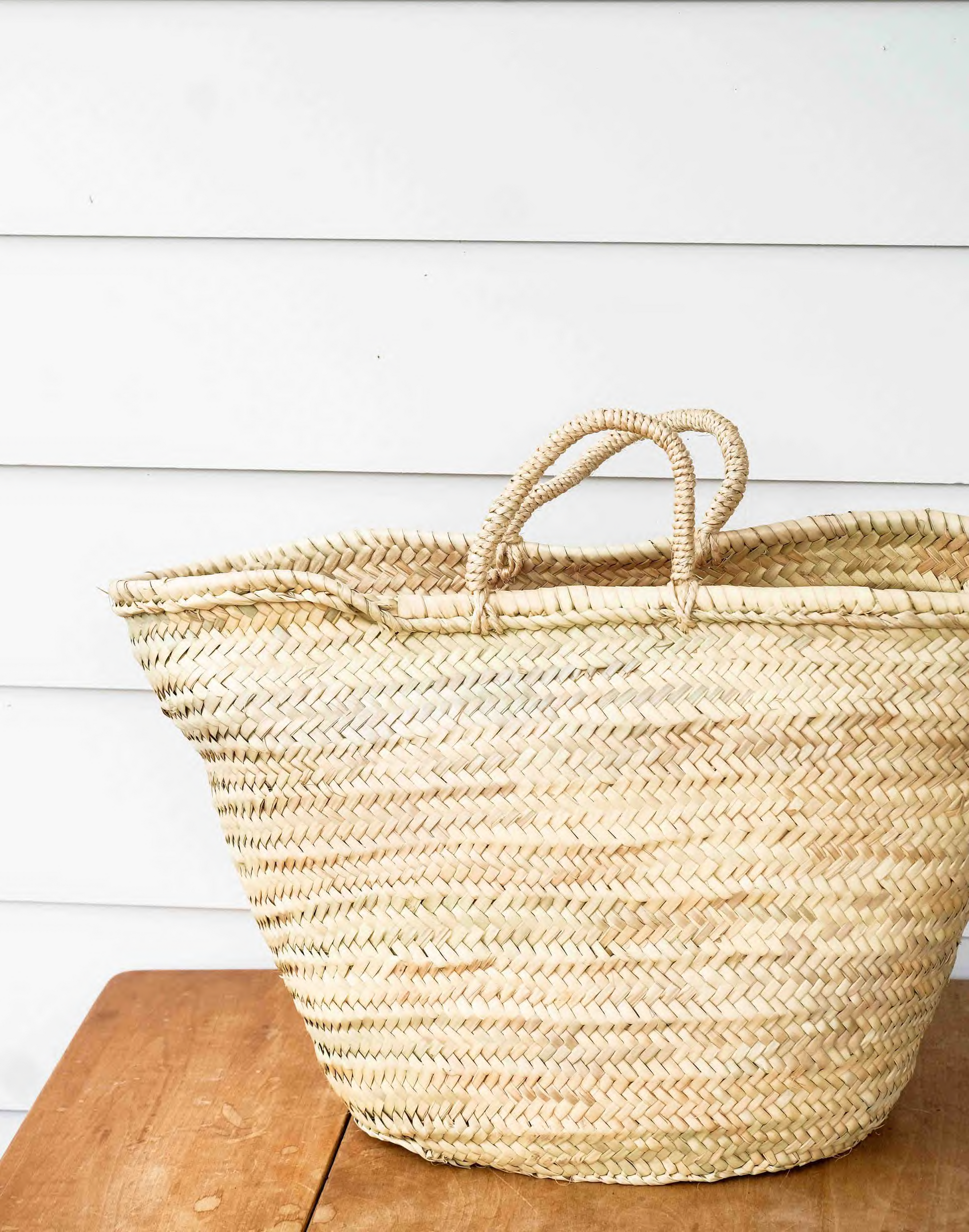 Farmer’s Market Basket by Bella Cucina, a gourmet collection of artisanal food products in a rustic woven basket.