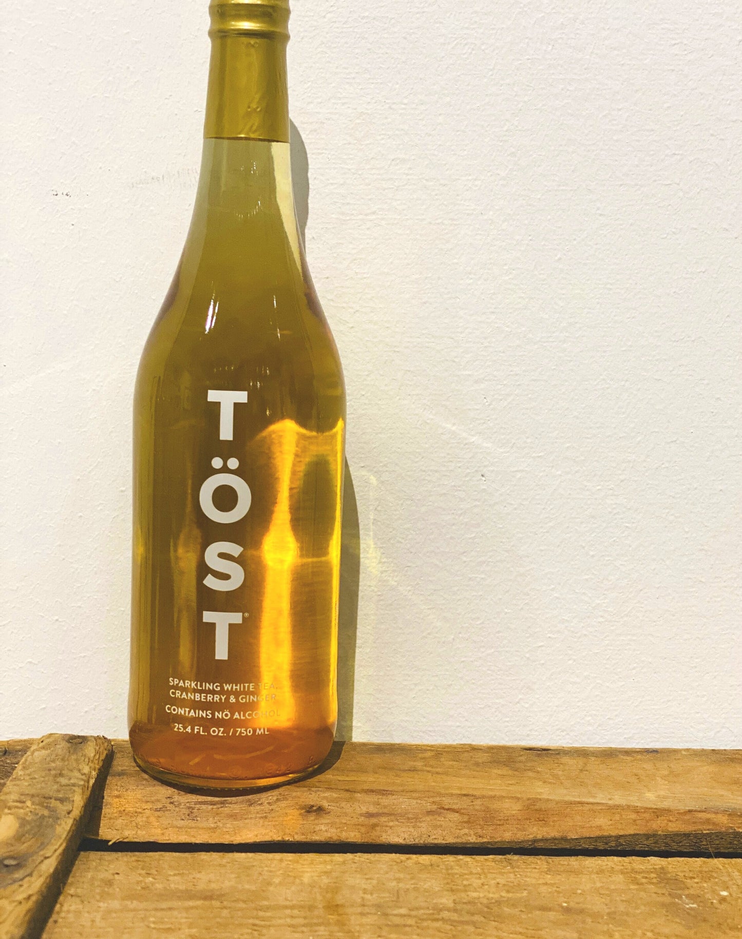 TÖST non-alcoholic sparkling beverage, a crisp and refreshing drink made with white tea, white cranberry, and ginger, available at Bella Cucina.